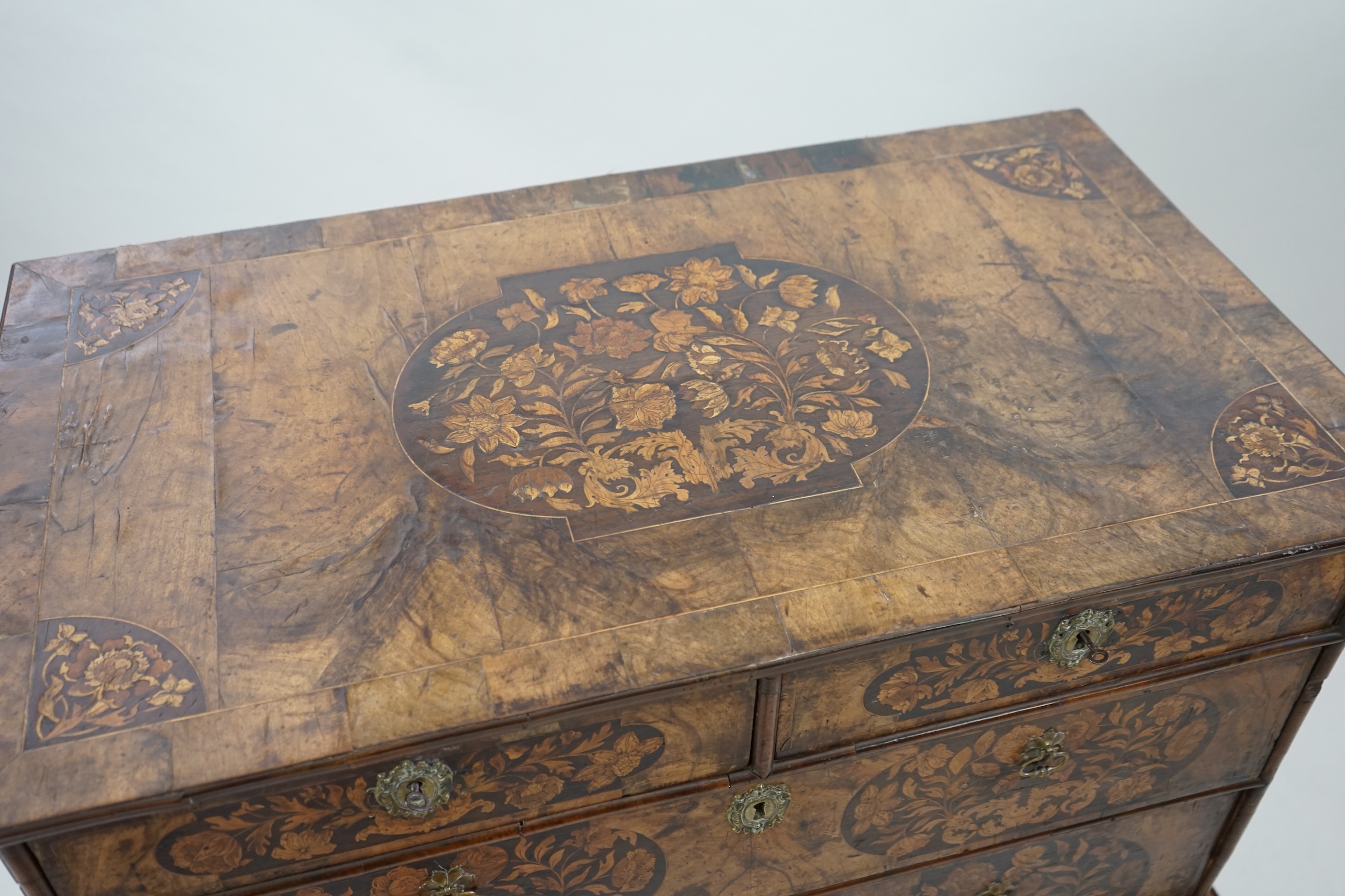 A William and Mary walnut and marquetry chest on stand